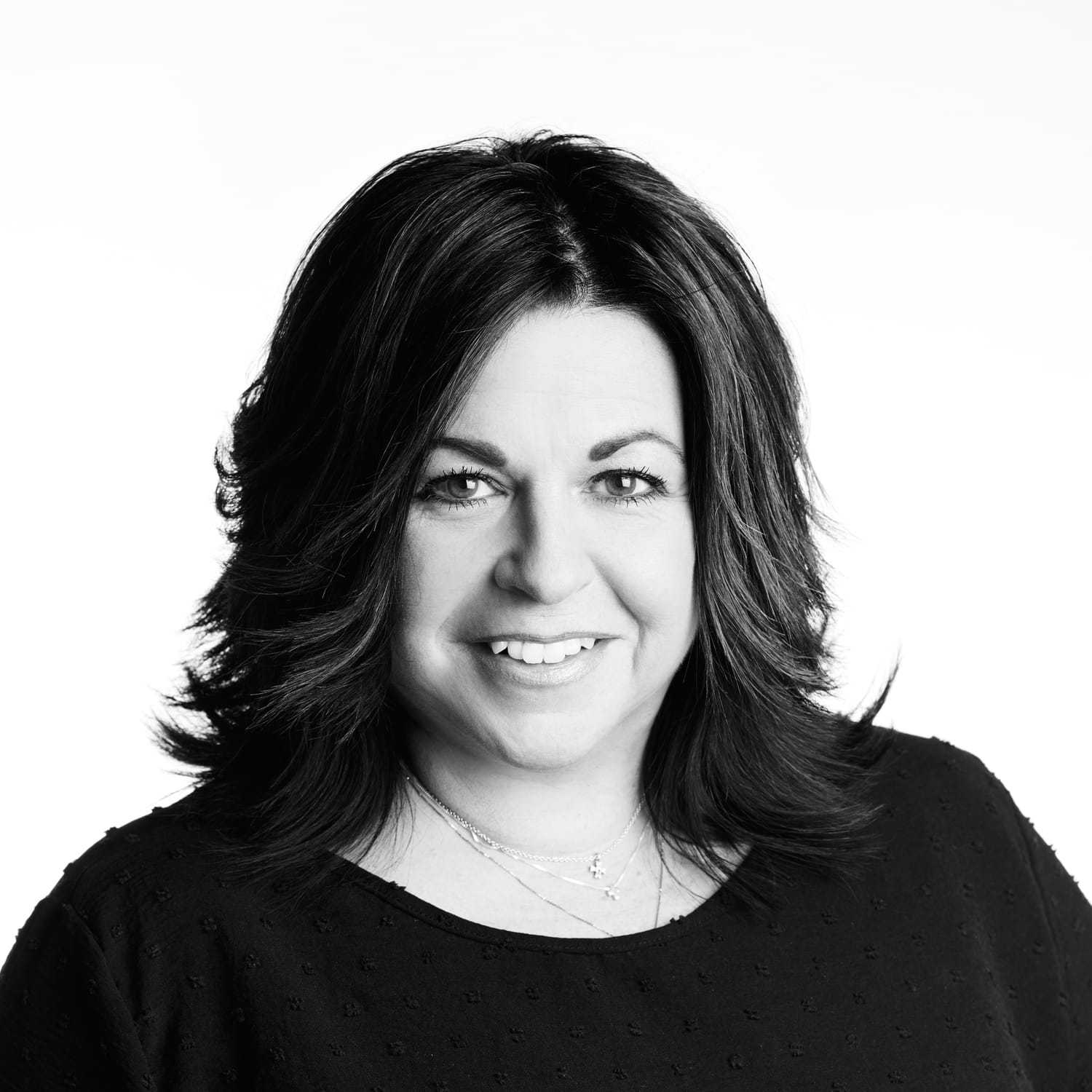 Portrait of Tammy, a professional stylist at Izzazu Salon, showcasing their expertise and style.