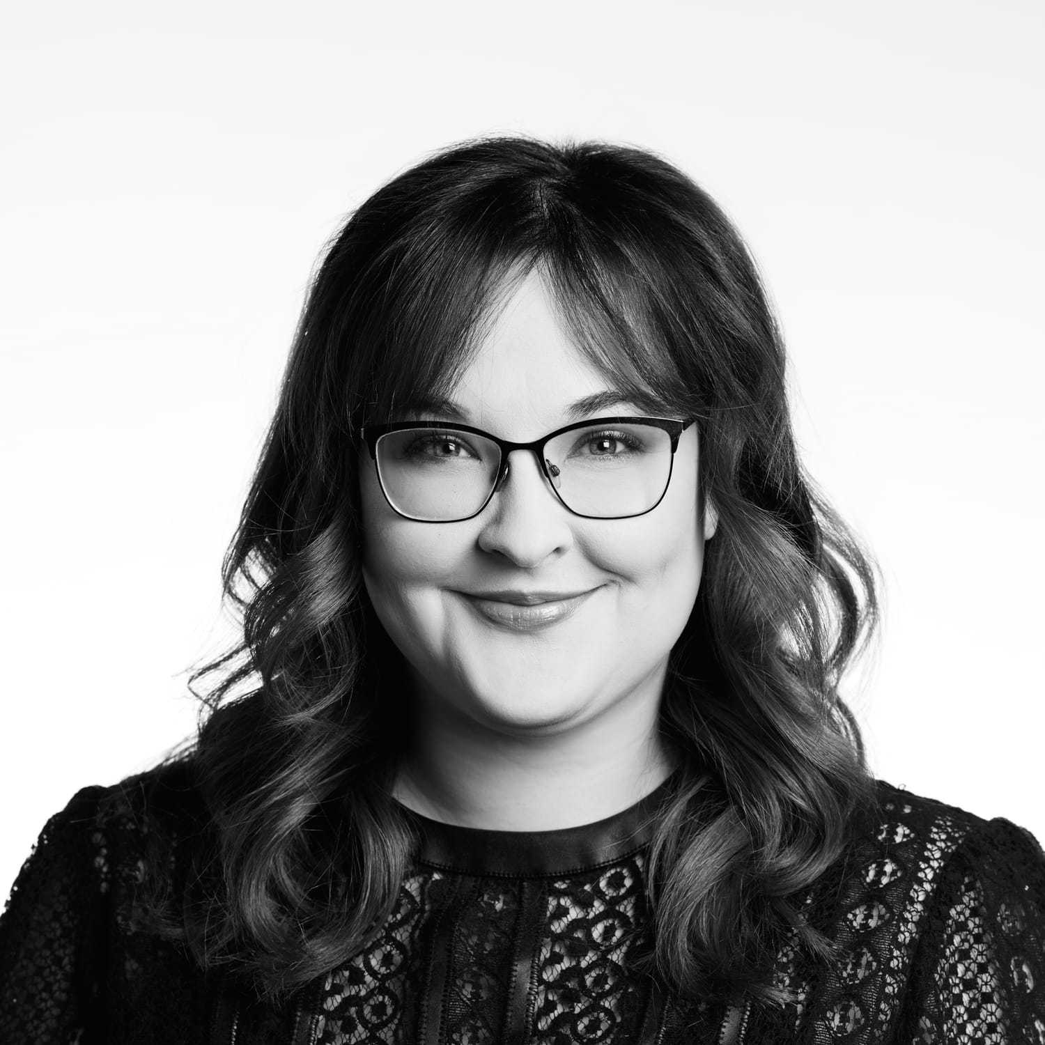 Portrait of Mazie, a professional stylist at Izzazu Salon, showcasing their expertise and style.