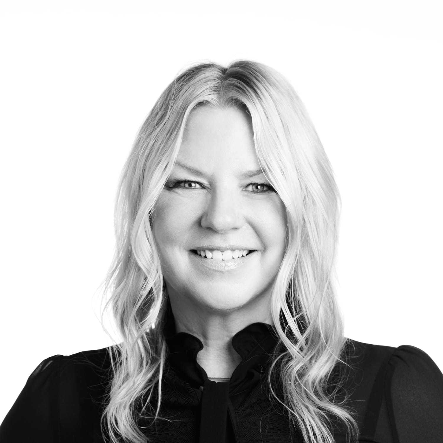 Portrait of Renee, a professional stylist at Izzazu Salon, showcasing their expertise and style.