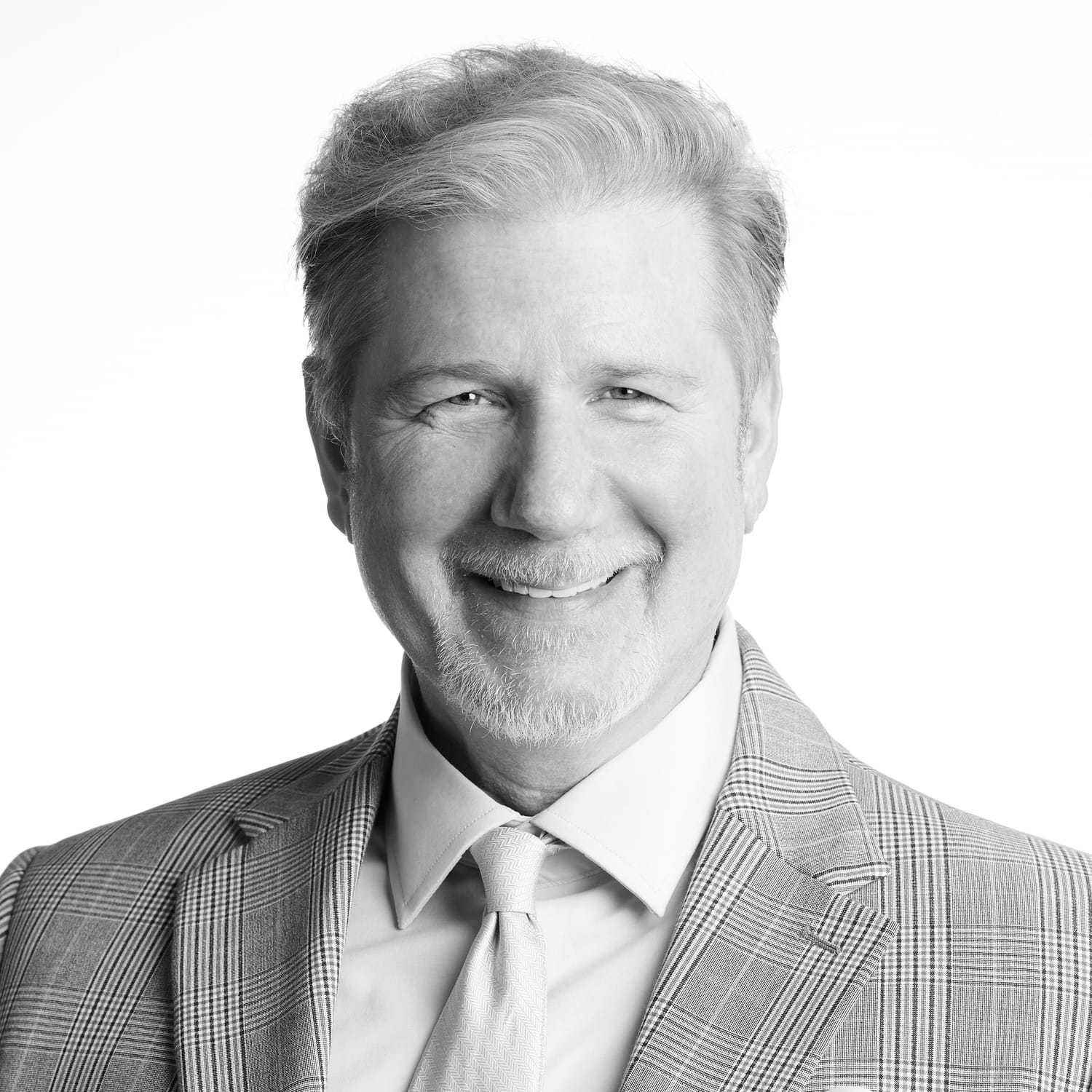 Portrait of Cesare, a professional stylist at Izzazu Salon, showcasing their expertise and style.