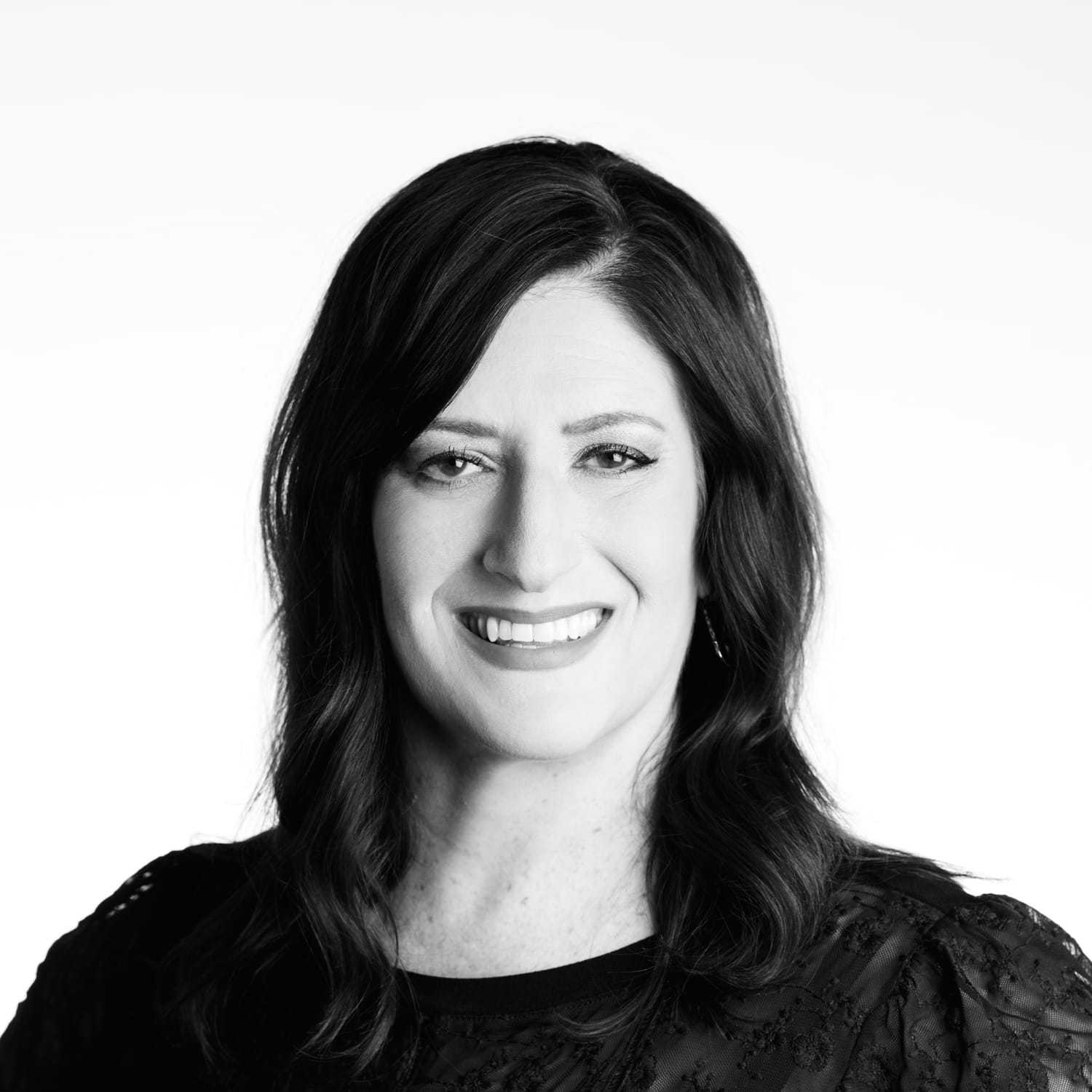 Portrait of Jennifer, a professional stylist at Izzazu Salon, showcasing their expertise and style.