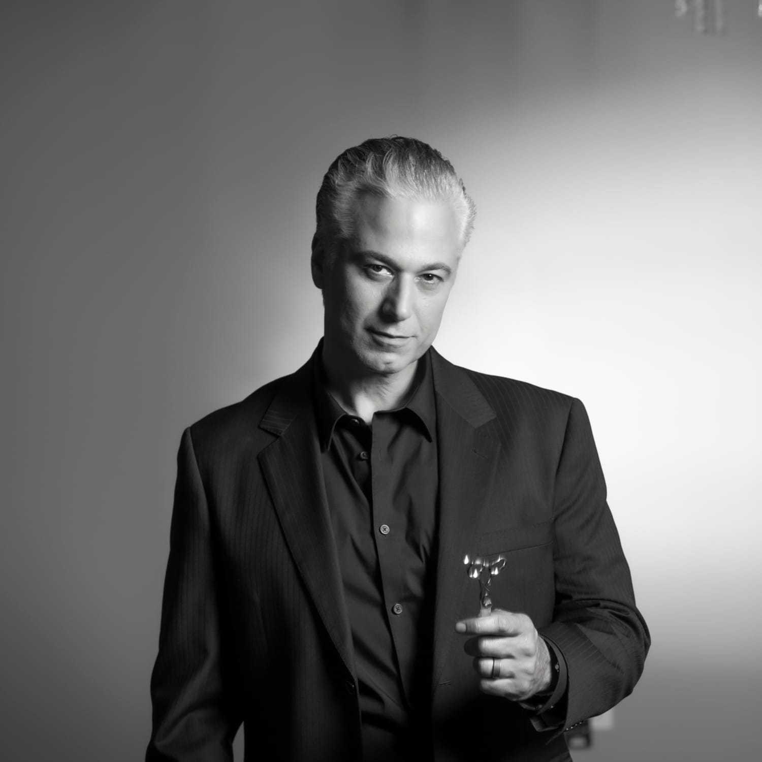 Portrait of Emilio Cornacchione, a professional stylist at Izzazu Salon, showcasing their expertise and style.