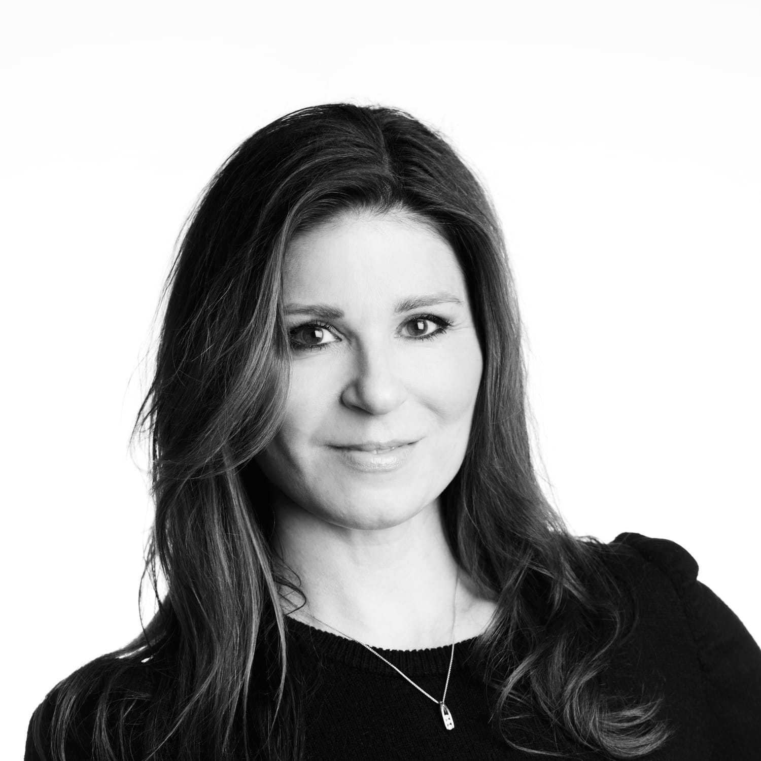 Portrait of Lisa, a professional stylist at Izzazu Salon, showcasing their expertise and style.