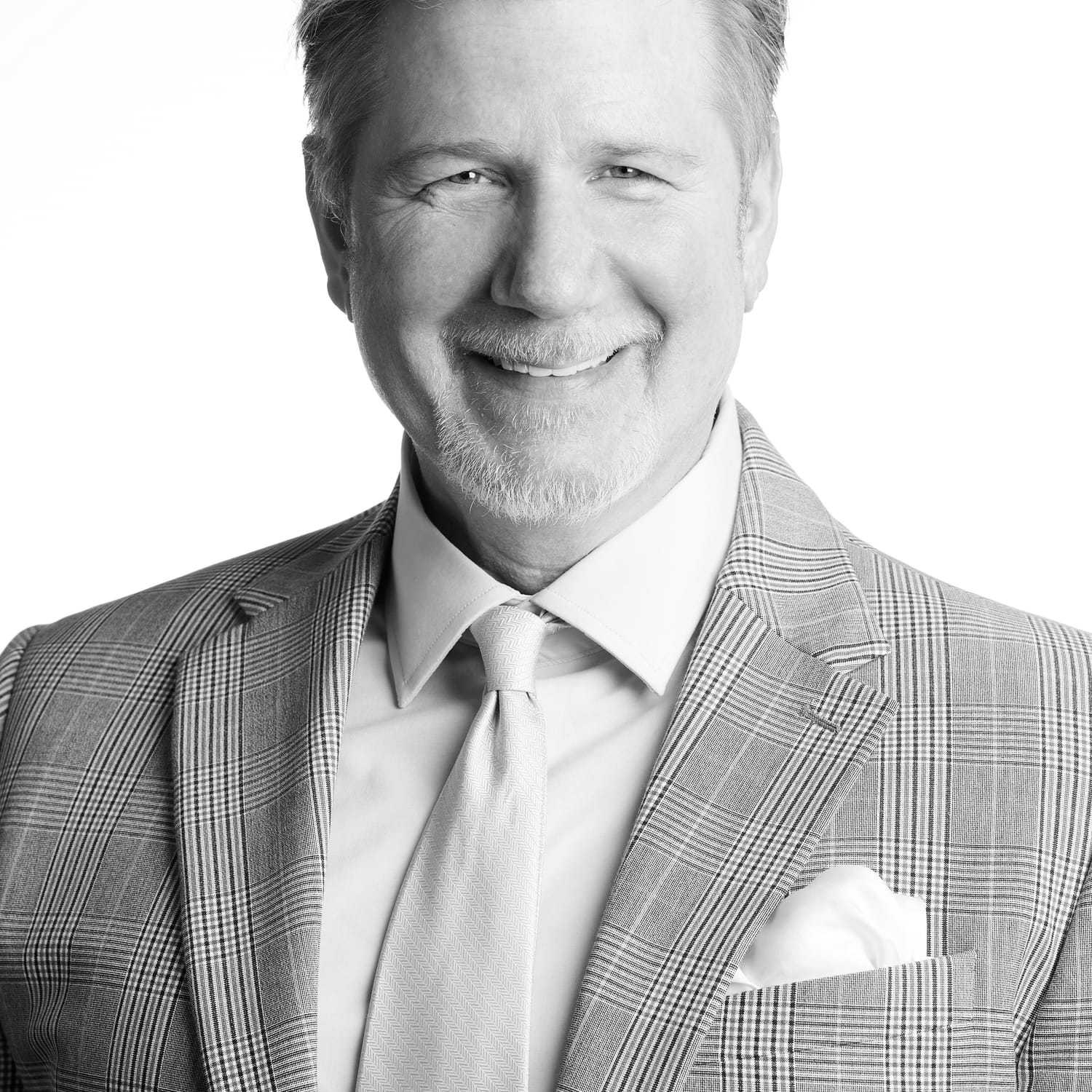 Portrait of Cesare, a professional stylist at Izzazu Salon, showcasing their expertise and style.