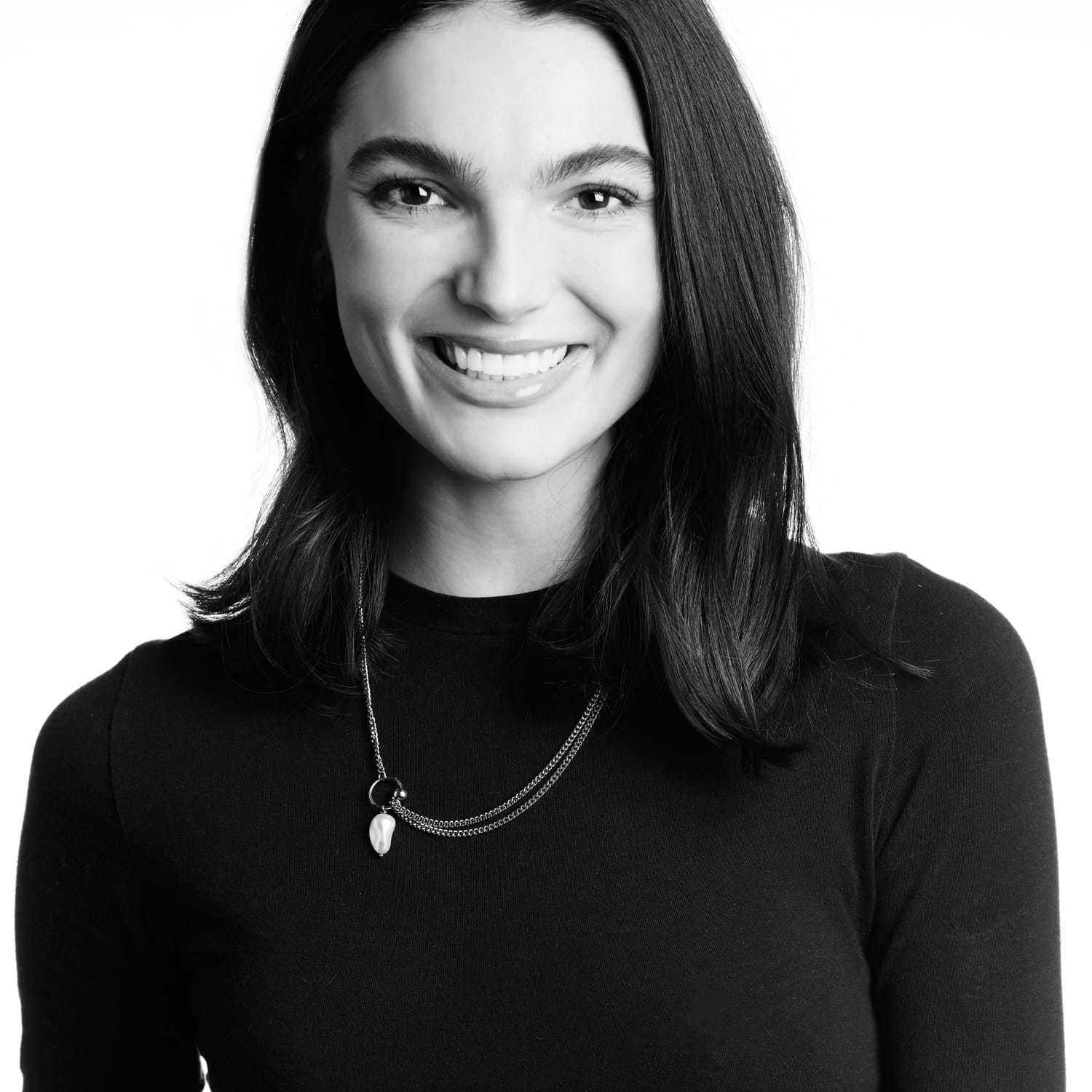 Portrait of Rachel, a professional stylist at Izzazu Salon, showcasing their expertise and style.