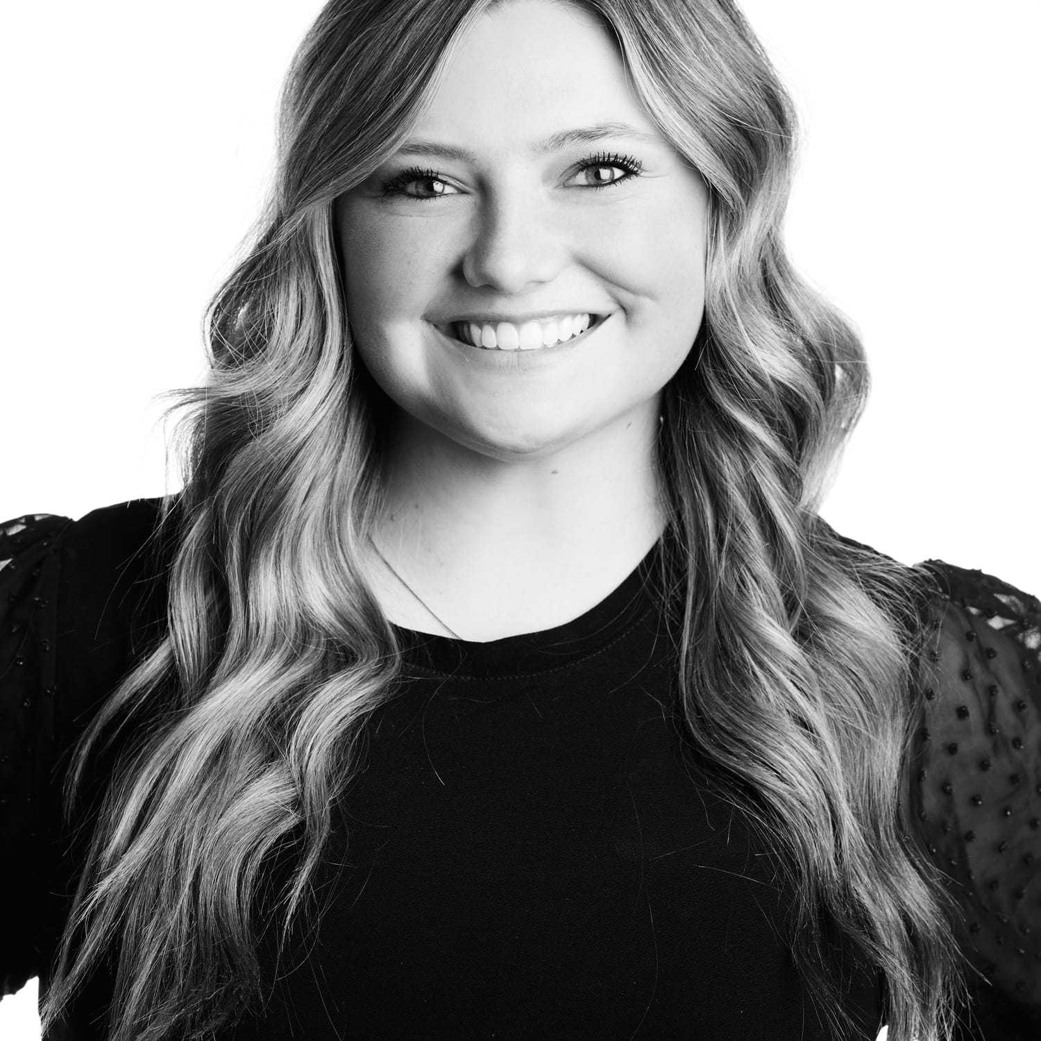 Portrait of RJ, a professional stylist at Izzazu Salon, showcasing their expertise and style.