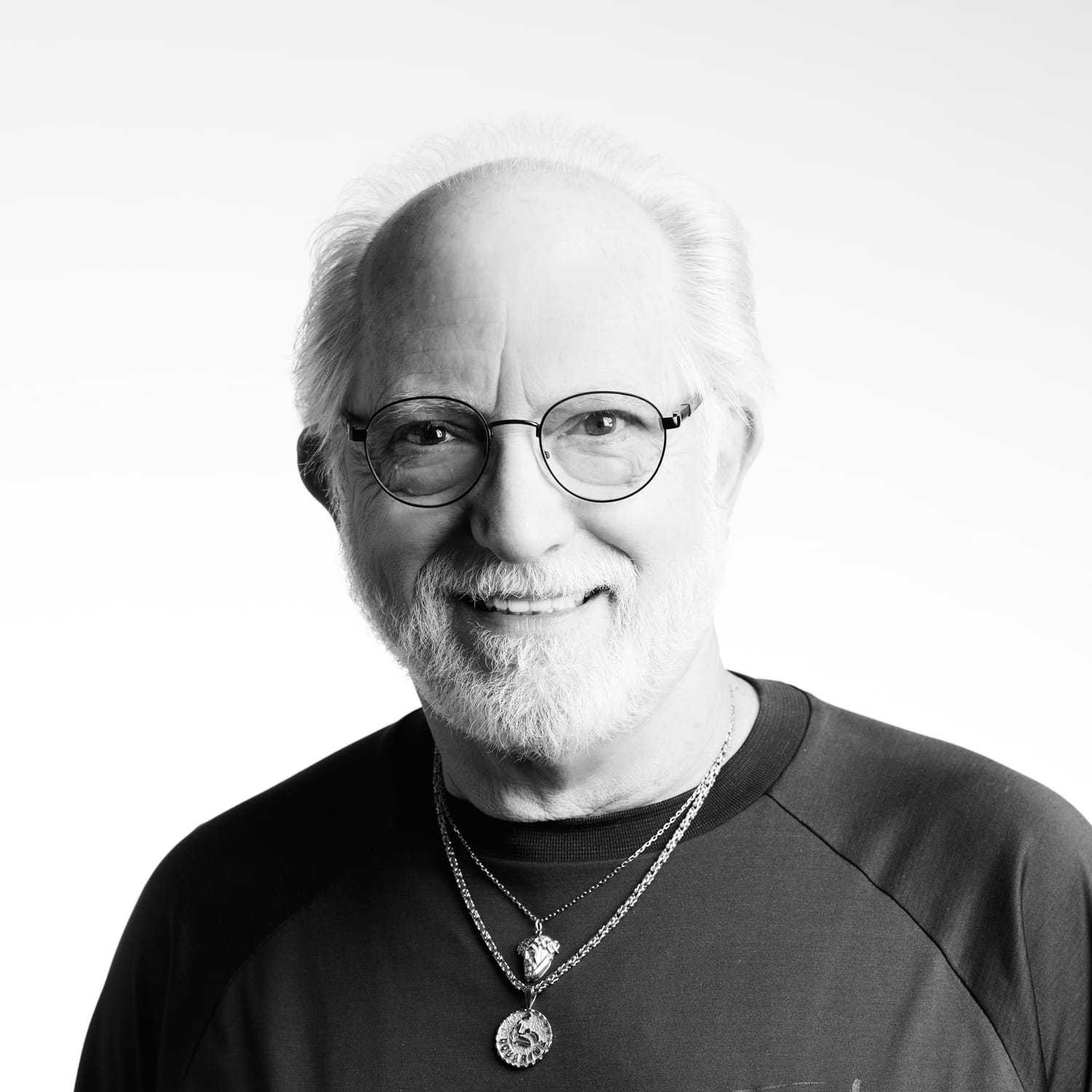 Portrait of Alex, a professional stylist at Izzazu Salon, showcasing their expertise and style.