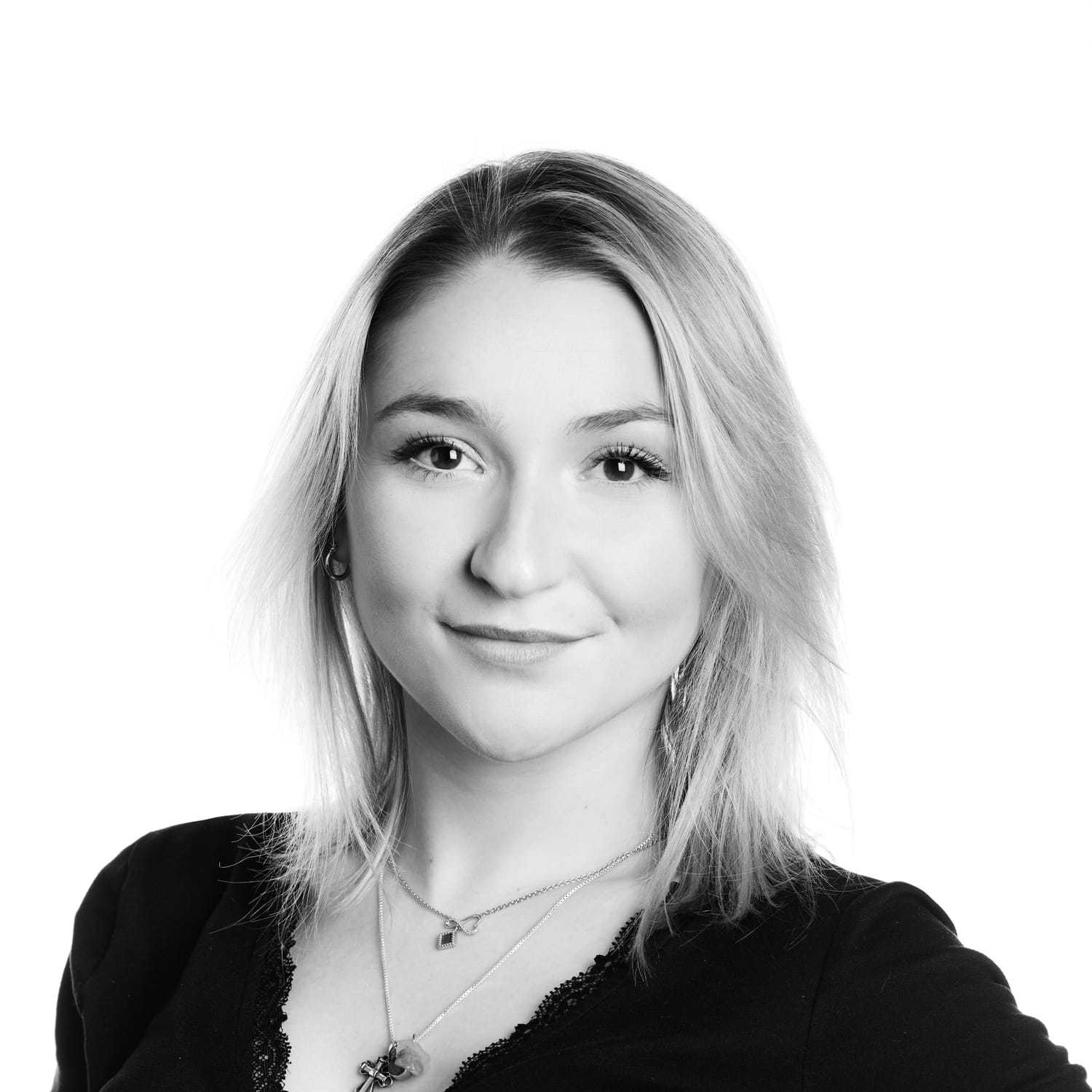 Portrait of Madison Mae, a professional stylist at Izzazu Salon, showcasing their expertise and style.